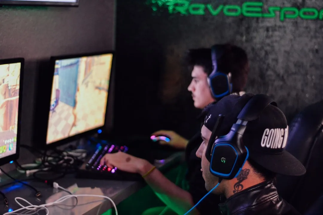 Two anonymous competitors competing in Counter-Strike: Global Offensive at the RavoEsports venue, photo by Alex Haney on Unsplash