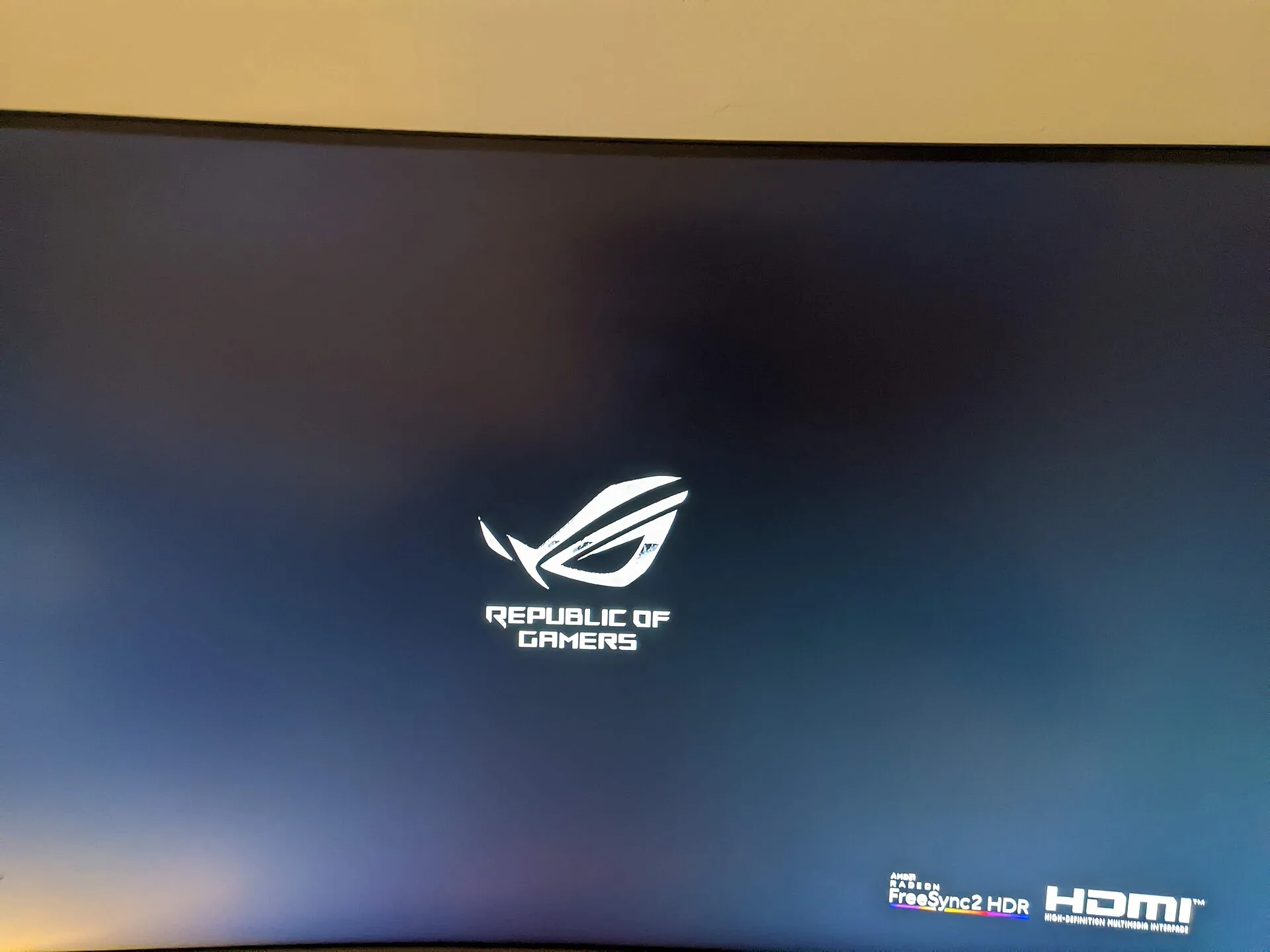 Close-up of an ASUS ROG gaming monitor's boot screen showing the Republic of Gamers logo, with AMD Radeon FreeSync2 HDR and HDMI badges visible. Photo by Evan0512, CC BY-SA 4.0 via Wikimedia Commons